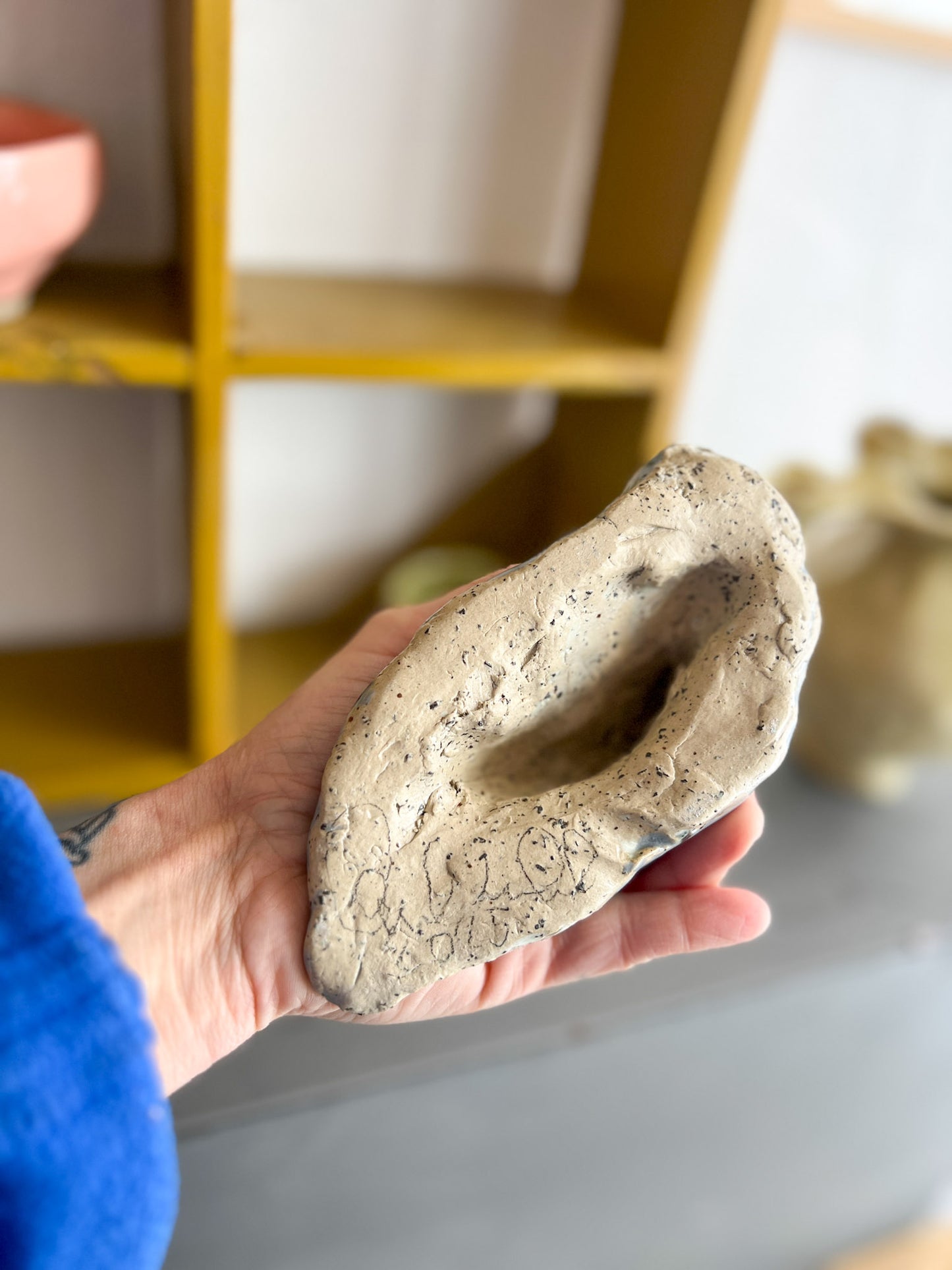 A Sitting Human - stoneware sculpture