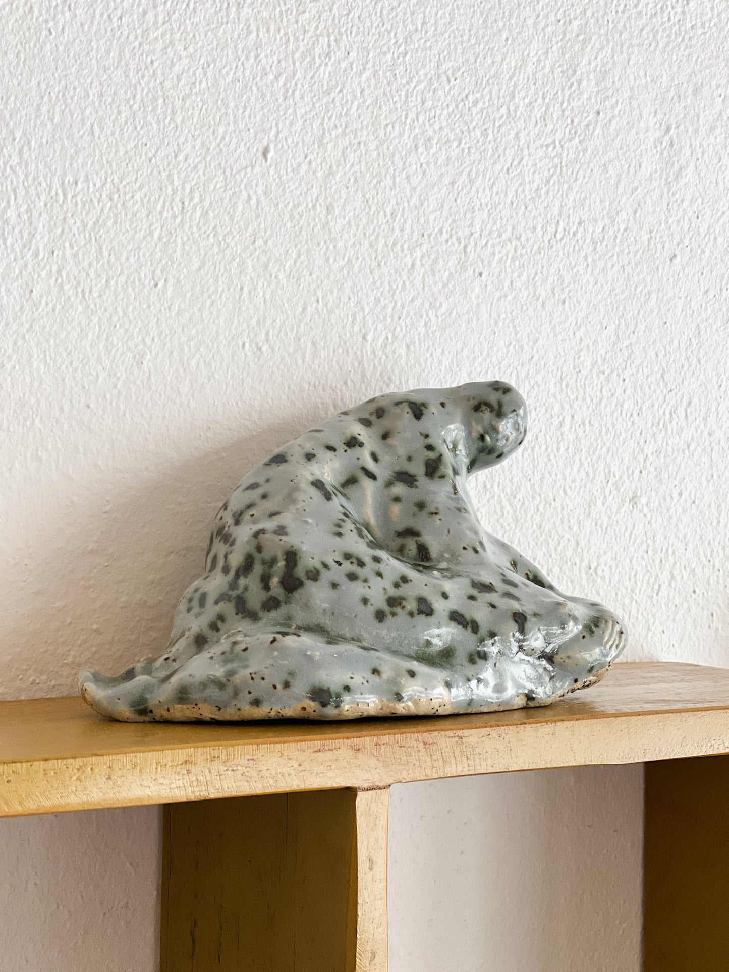 A Sitting Human - stoneware sculpture