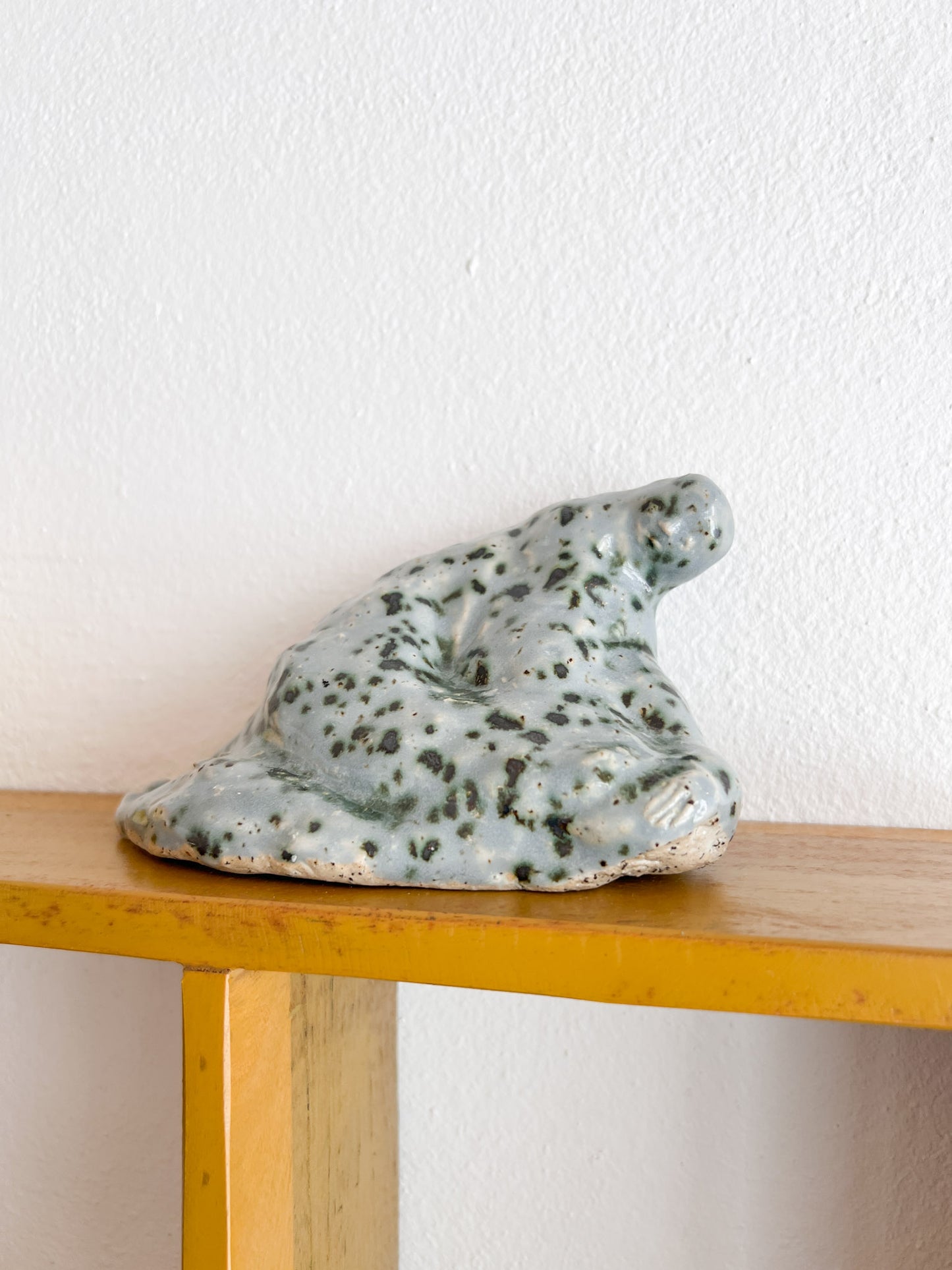 A Sitting Human - stoneware sculpture