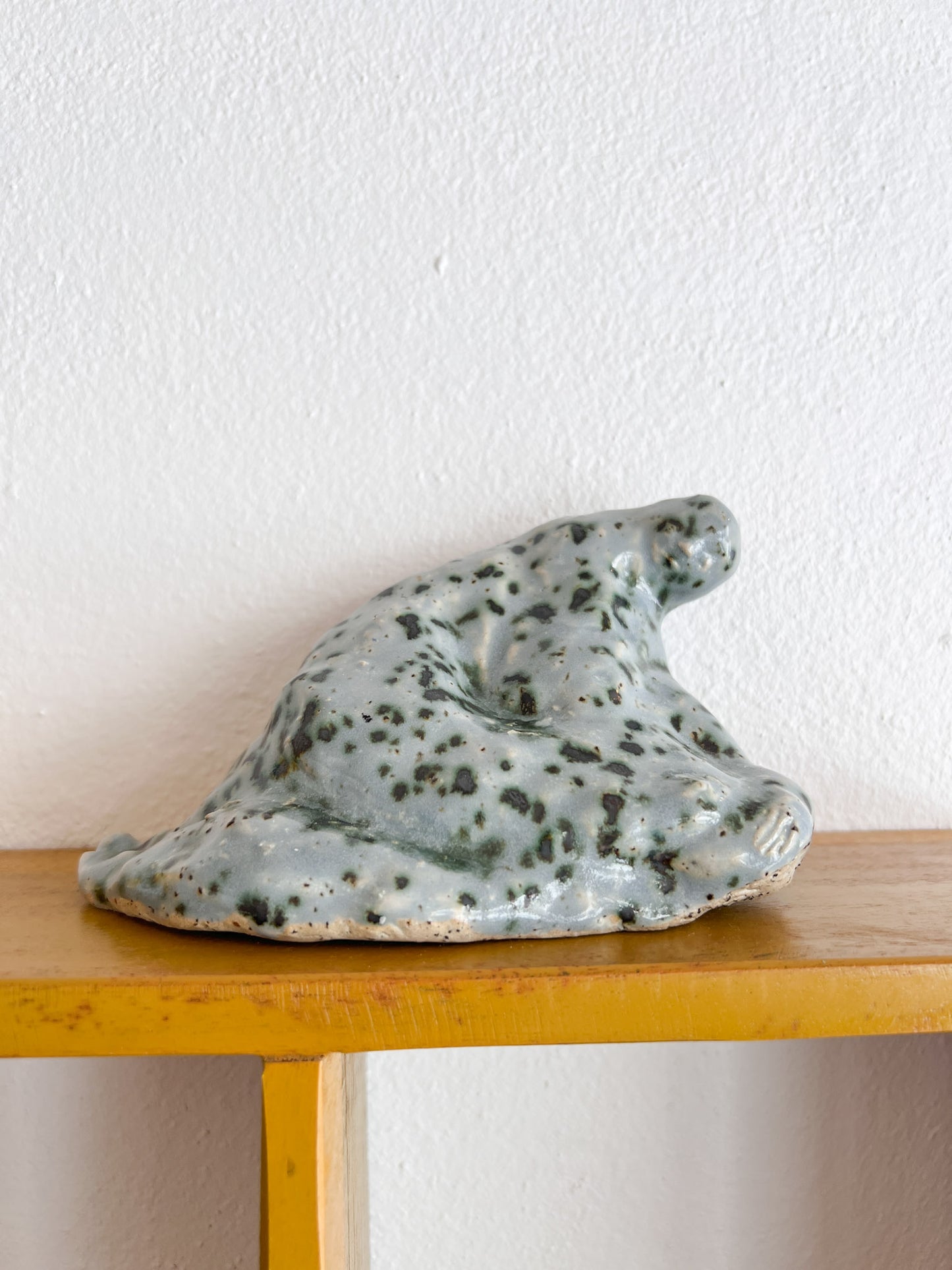 A Sitting Human - stoneware sculpture